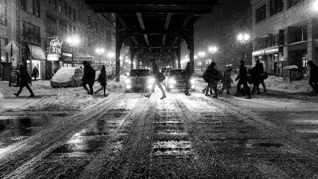 Night scene of a snowy weather with icy road