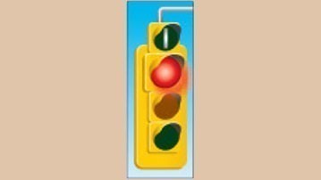 A traffic light with a round signal on top showing a white vertical bar on a dark background