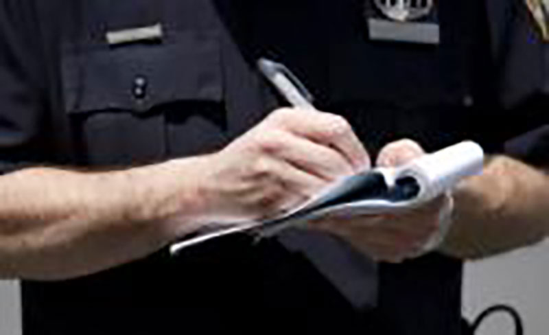 A police giving a traffic violation